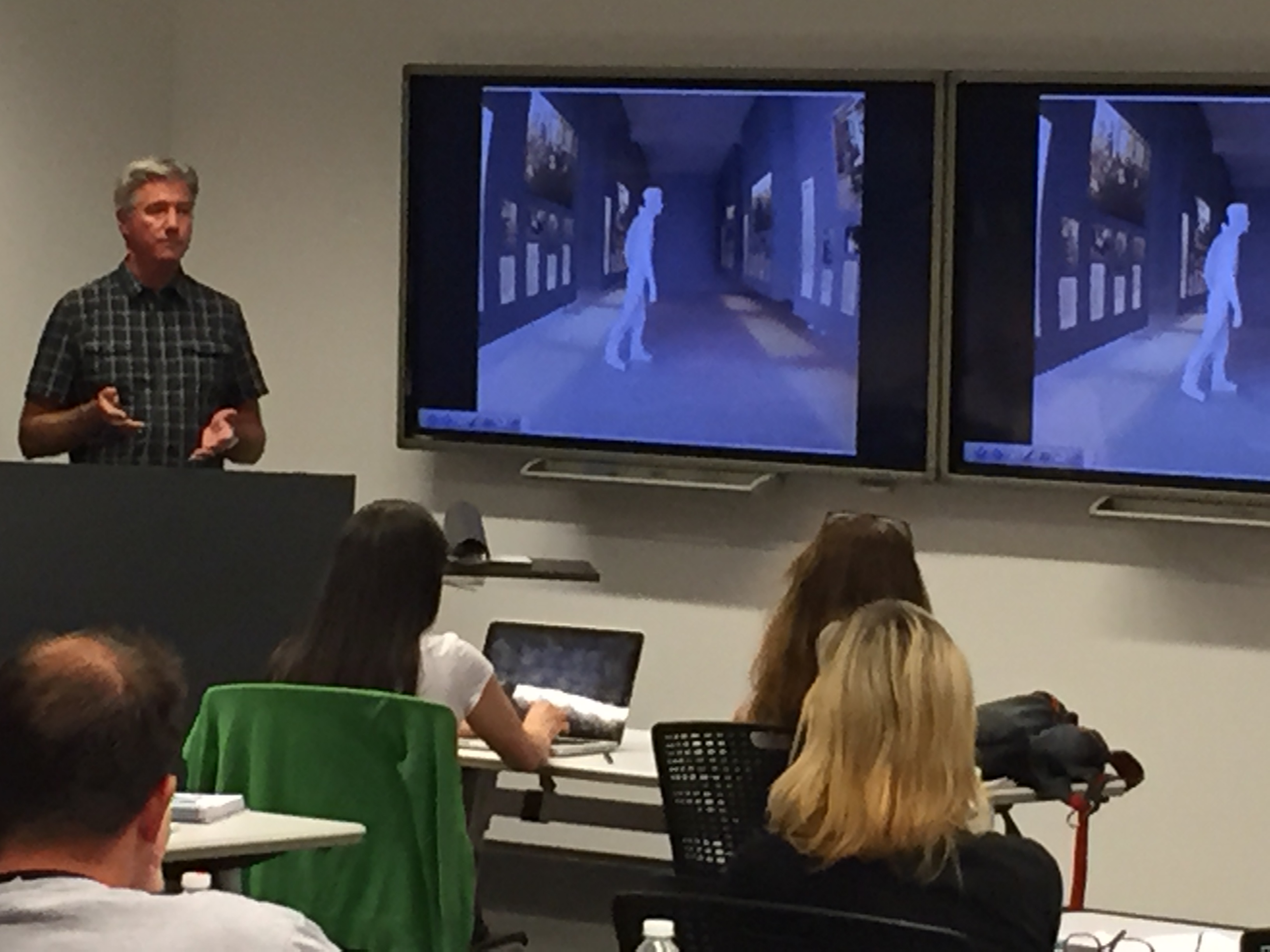 Professor James Young speaks about Holocaust memorials in Germany as students watch on.