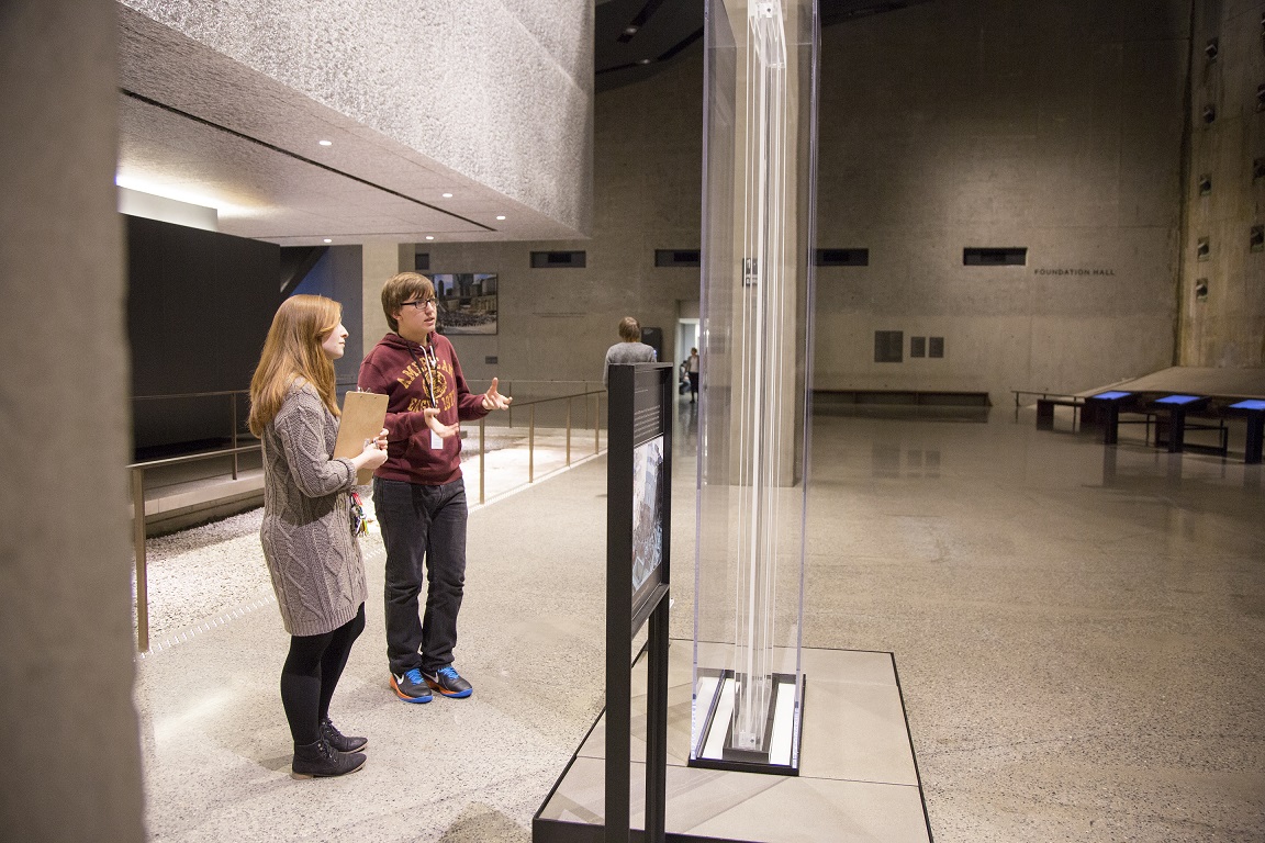 Christopher Demarest, a sophomore  at Bard High School Early College in Queens, speaks with 9/11 Memorial Museum Educational Specialist Chelsea Pellissier.