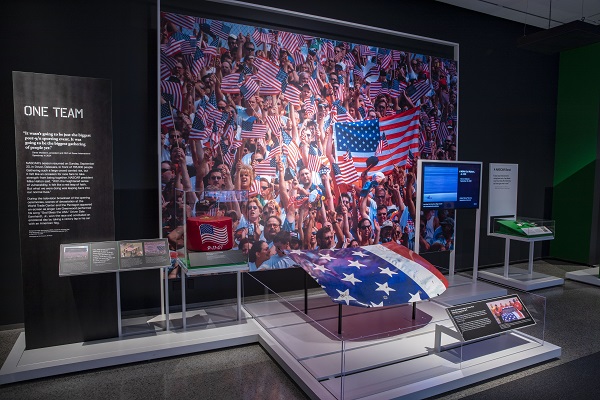 A folded American flag and other sports artifacts are on display at the exhibition, Comeback Season: Sports After 9/11. 