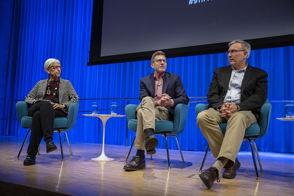 Three panelists, including two men and a woman, discuss the history of the slurry wall during a public program at the Museum’s auditorium.