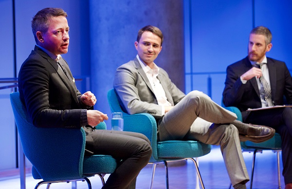 Thomas Hegghammer, Cole Bunzel, and Noah Rauch, senior vice president of education and public programs, sit onstage during a public program at the Museum auditorium.