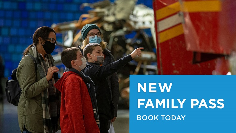 This photograph features a mask-wearing family with two young children looking at the Ladder 3 firetruck in the Museum. In the bottom right corner, "New Family Pass, Book Today" appears in a blue box.