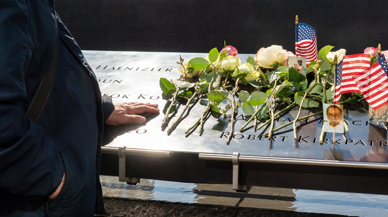 Flowers and small flags are left as tributes in the names parapet to commemorate the 28th anniversary of the 1993 attacks.