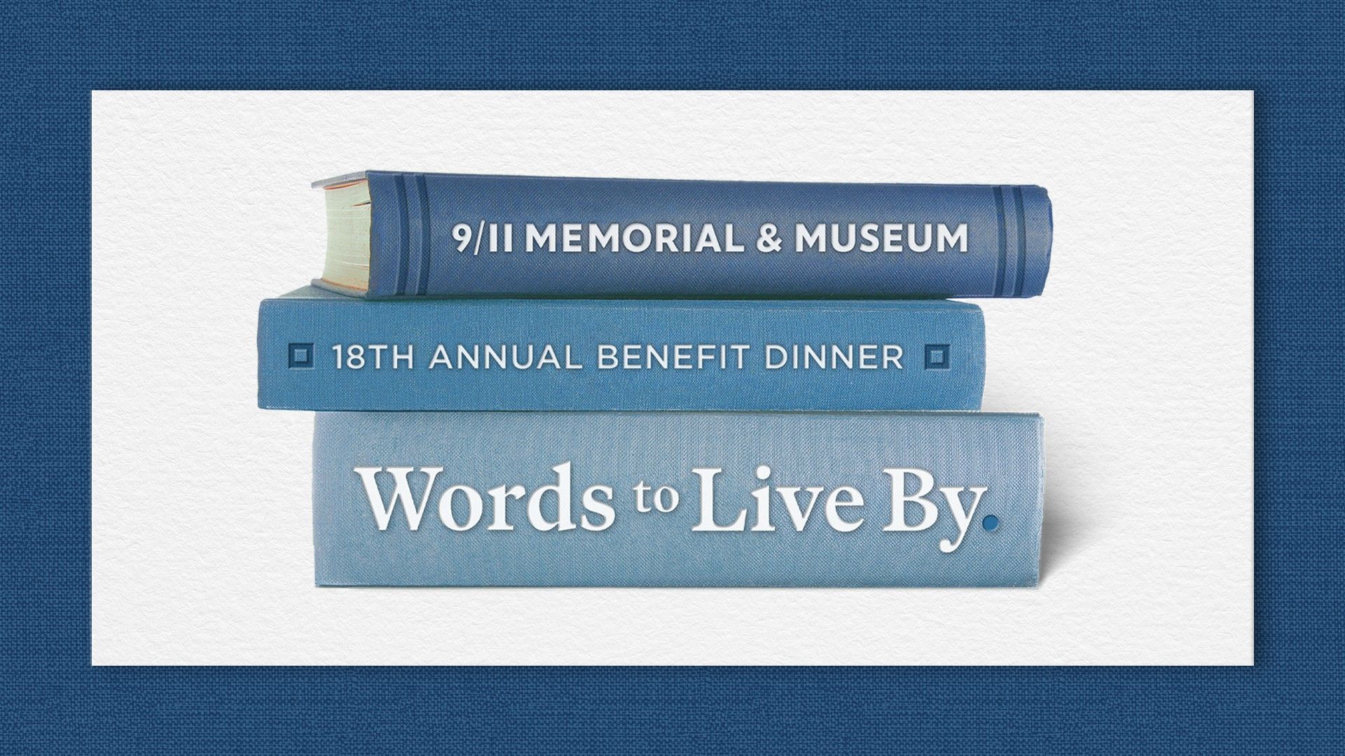 Three books, in different shades of blue, are stacked on top of each other so that the spine of each one is visible.