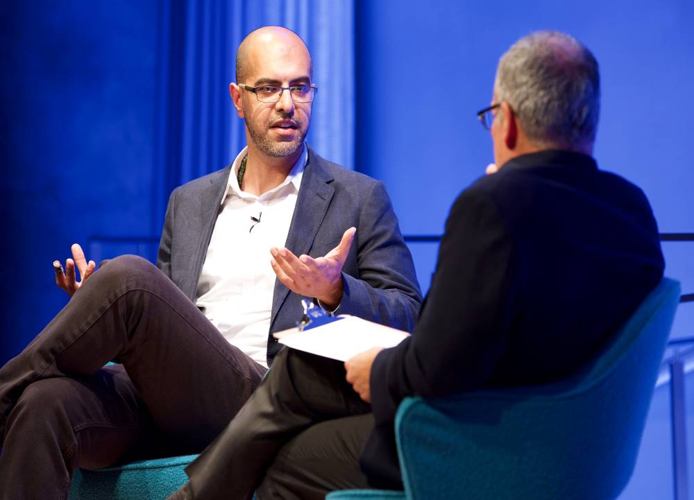 Author and news commentator Haroon Moghul speaks onstage as he takes part in the public program, How to Be a Muslim.