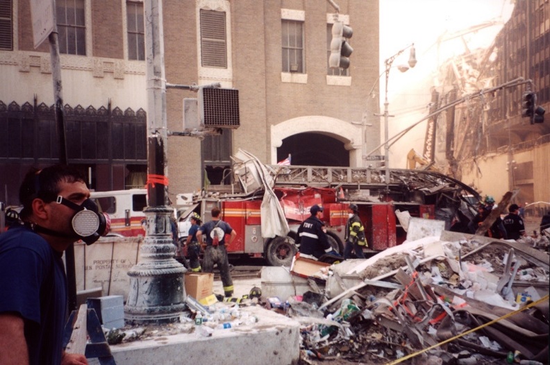 An archival photograph shows the smashed Ladder 3 firetruck at the World Trade Center site in the immediate aftermath of the 9/11 attacks. 