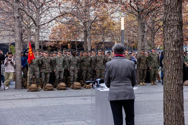 On the 249th birthday of the United States Marine Coros, Museum President & CEO Beth Hillman addresses 200 Marines and veterans on the Memorial at the conclusion of United War Veterans Council's Honor Ruck. 