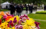 Colorful flowers on a Memorial Glade monolith