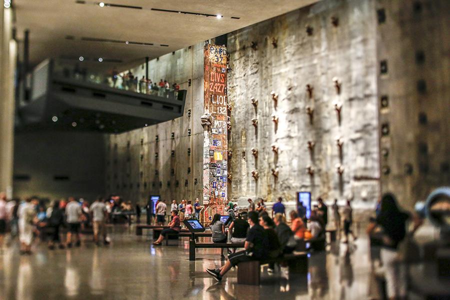 Last Column towers over dozens of visitors in Foundation Hall. The slurry wall is seen in the background.