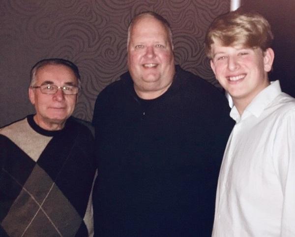 9/11 Memorial & Museum volunteers Bill and John Spade pose for a photo with Jan Demczur, a window washer at the World Trade Center who used a squeegee handle to escape from an elevator on 9/11.