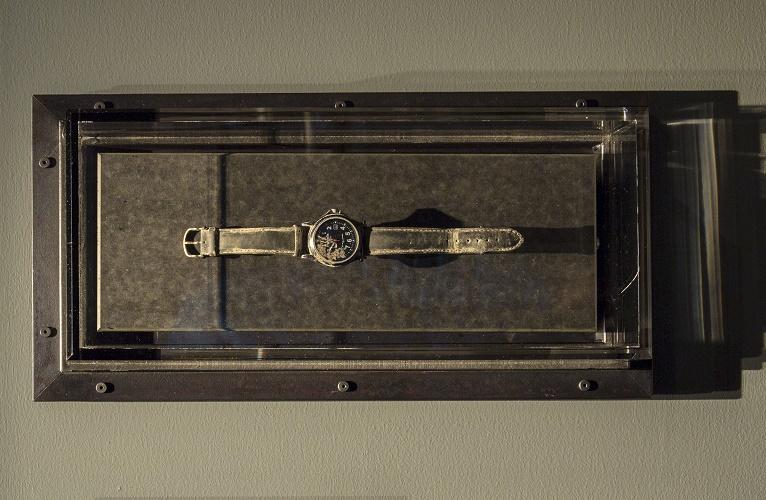 A dust-coated, battery-operated, and water-resistant men's wristwatch belonging to Tom Canavan is displayed at the Museum.